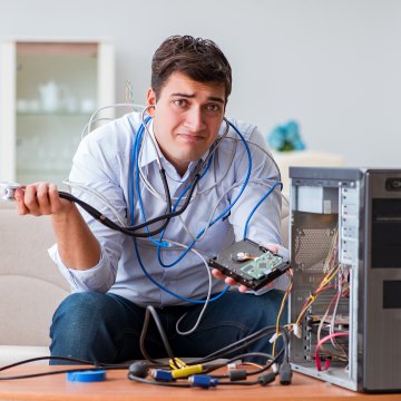 Sad guy with a broken computer