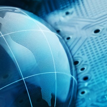 Image of globe against circuit board