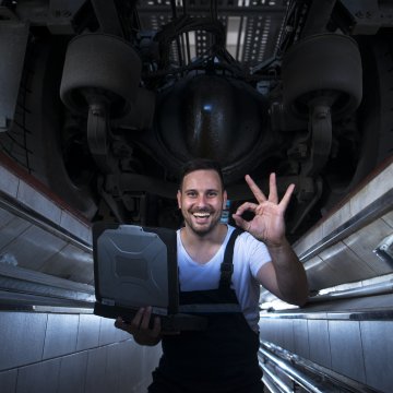 A home user giving the a-ok sign after fixing their PC.