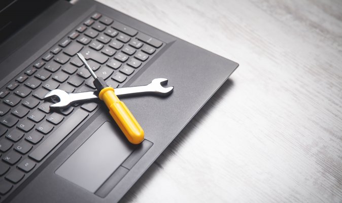 Computer with tools to fix issues on the keypad.