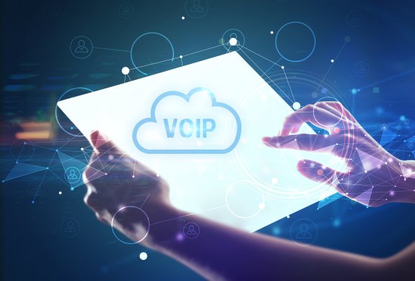 Voip phone system in the cloud on a screen with a hand overtop of it. 