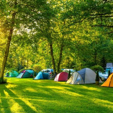 hilleberg niak 2-person tent backpacking tents tents in camping area nature trees green grass sun  