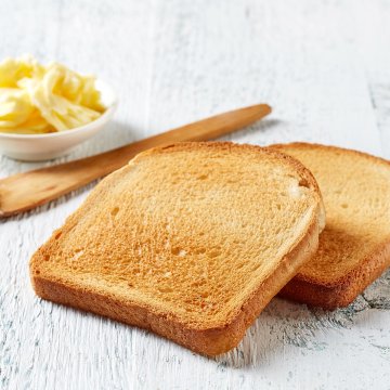 slices of bread toast pop-up toasters krups 4-slice toaster butter wooden spoon