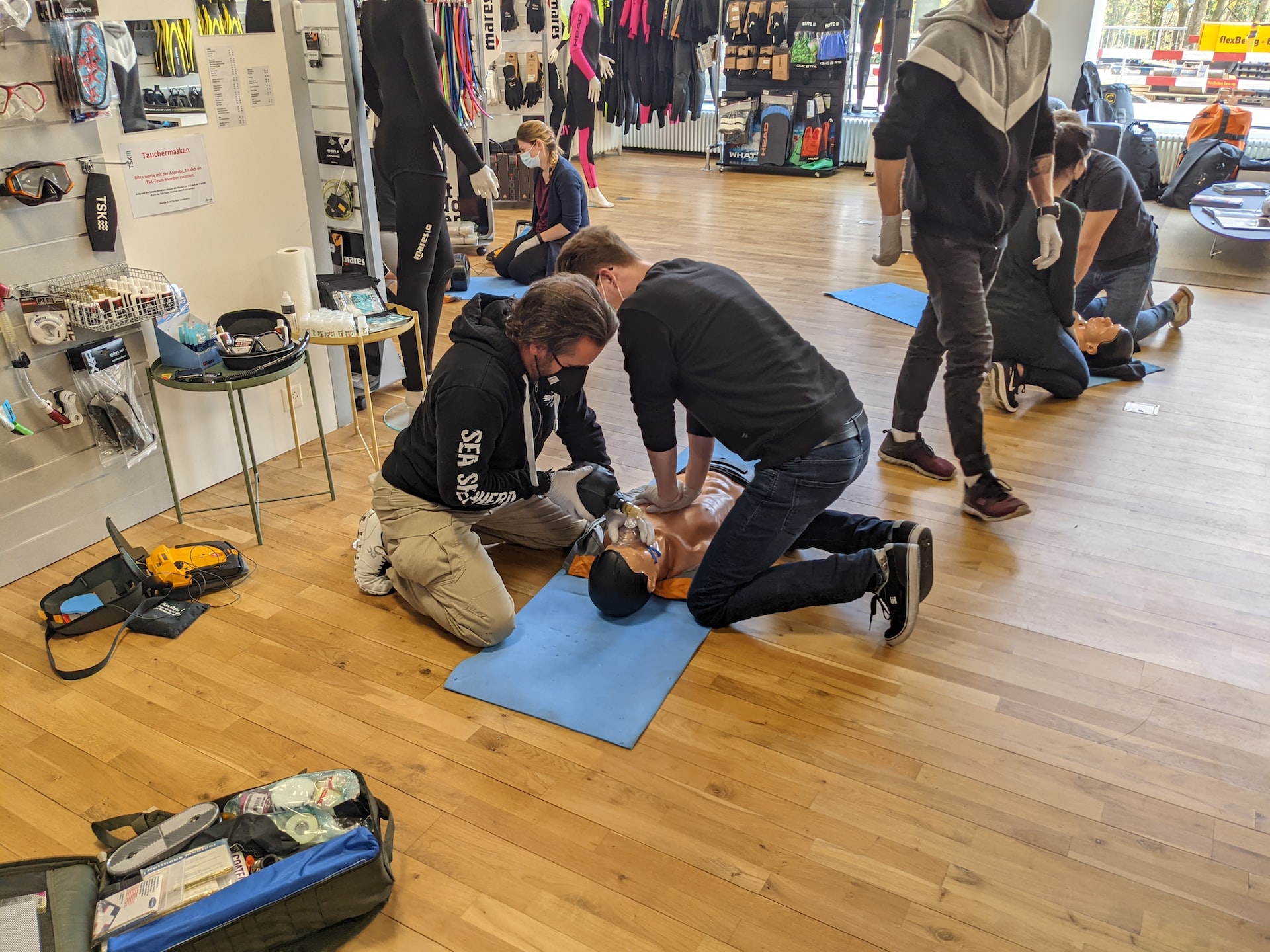 people in a classroom learning cpr