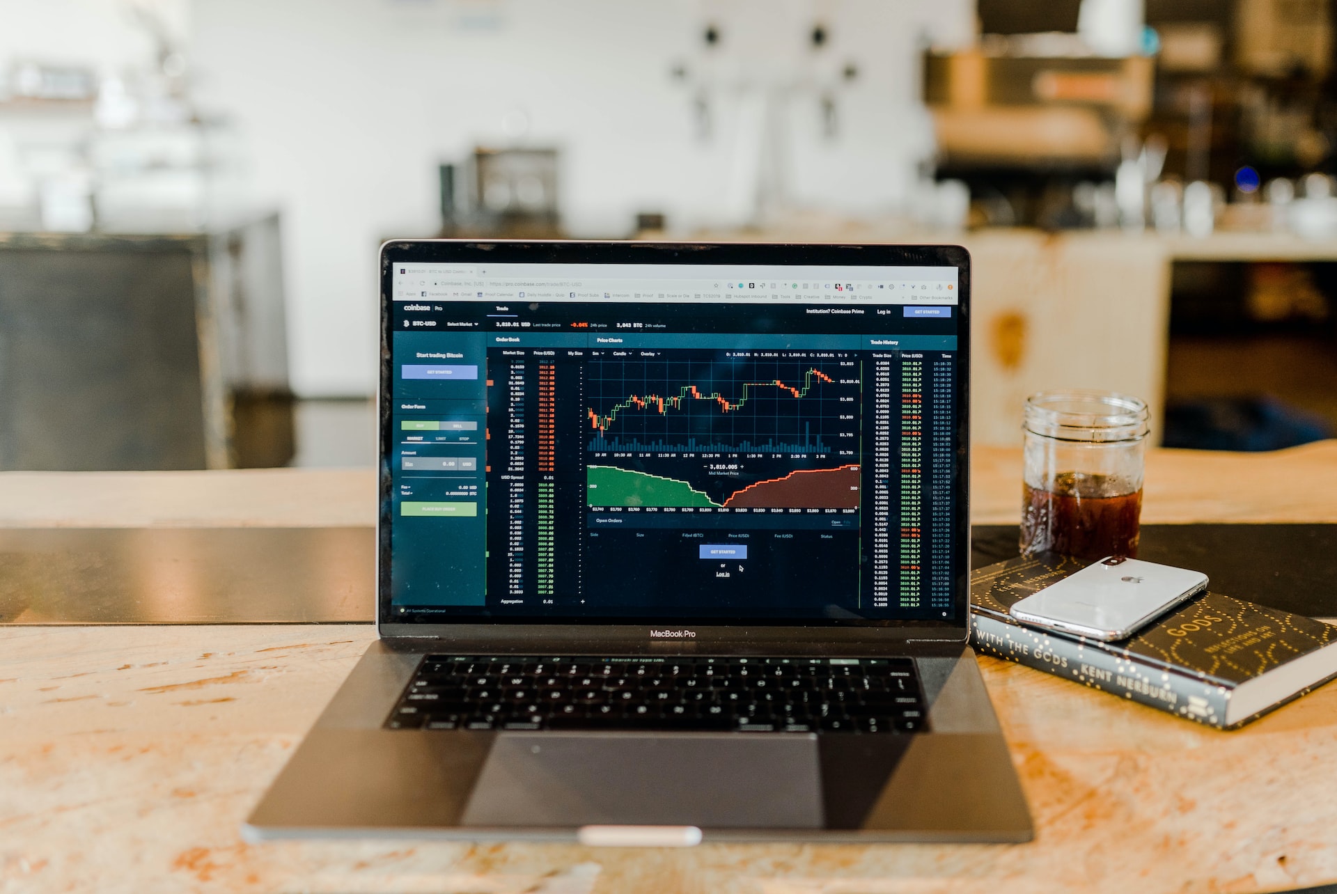 stock prices on a chart, displayed on a laptop