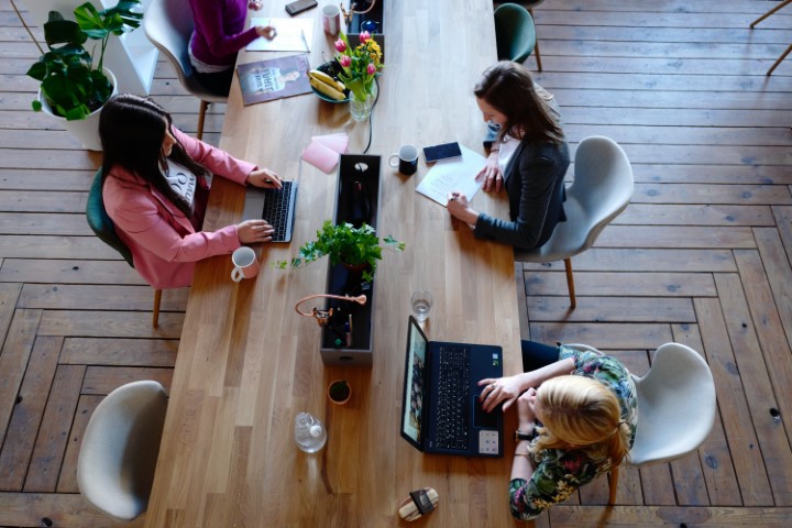 team at a desk getting ready to work