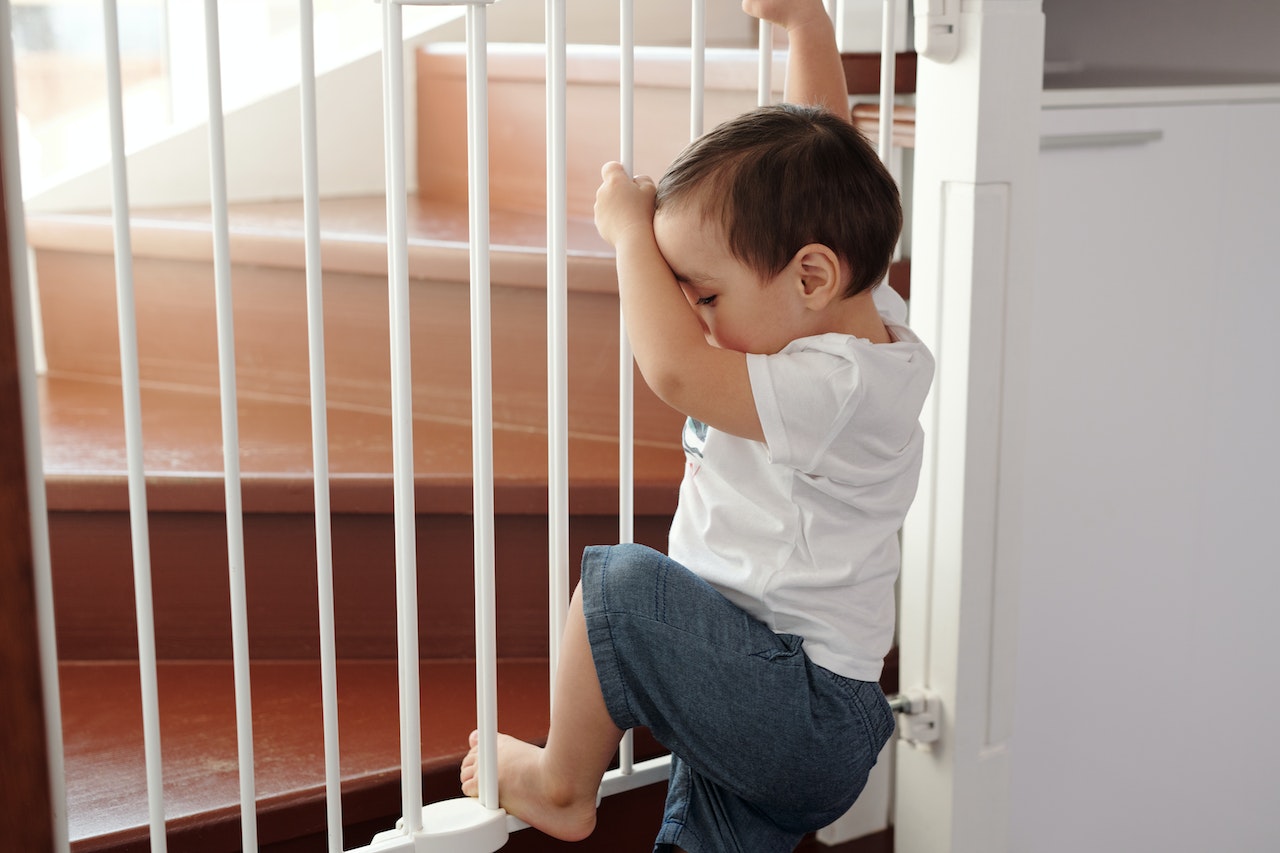 child gate keeping a toddler safe