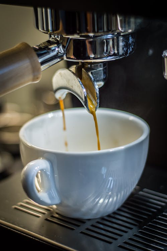 a cup of coffee being made in a machine