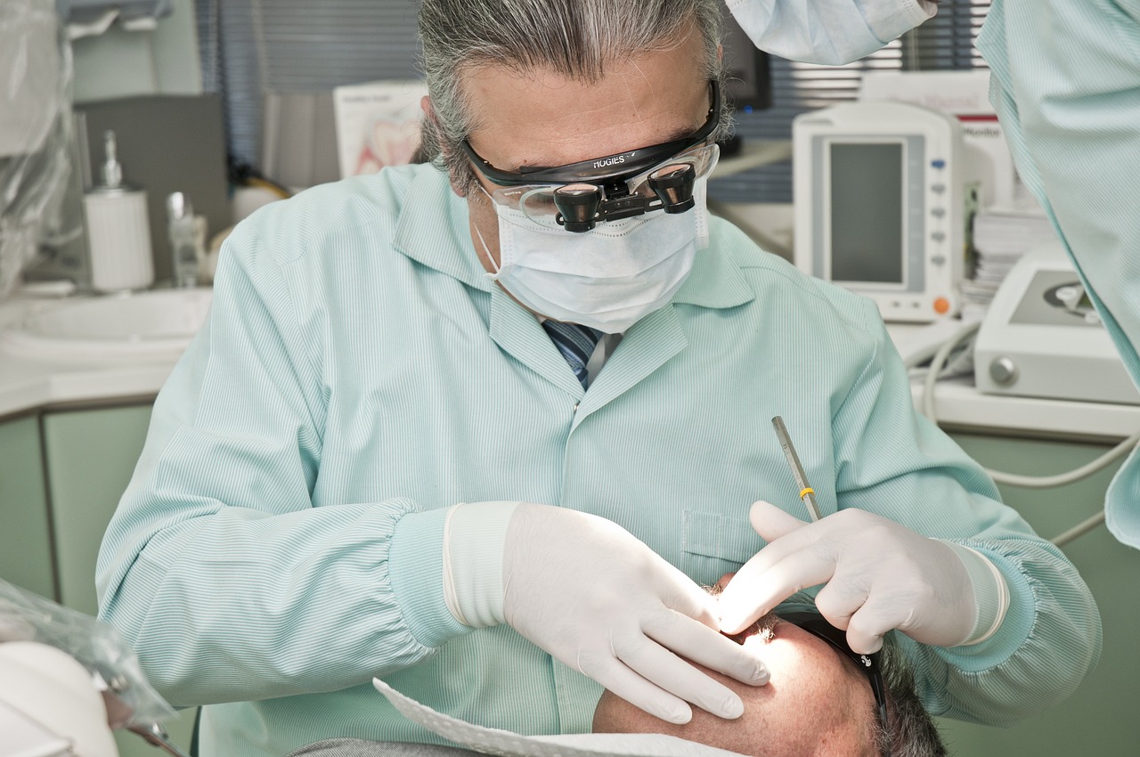 a dentist checking out the strength of teeth 