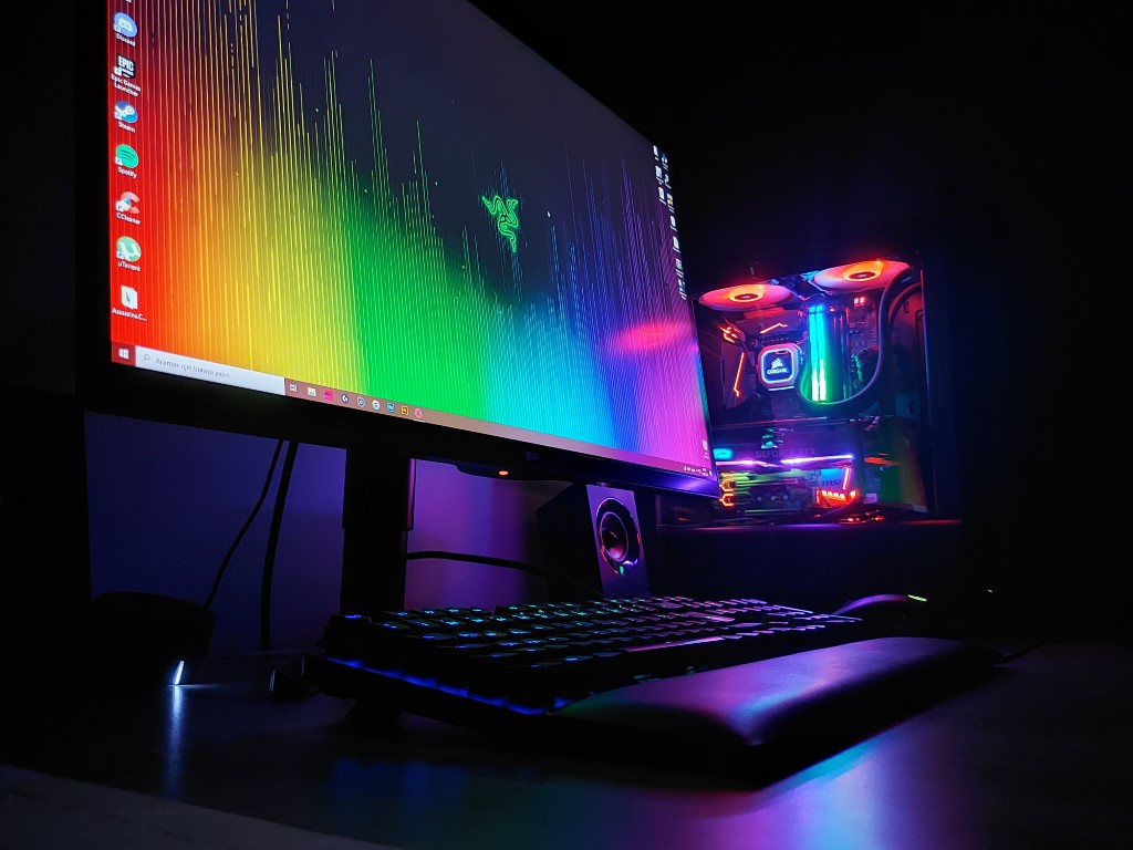 a nicely built gaming computer with bright lights on the screen