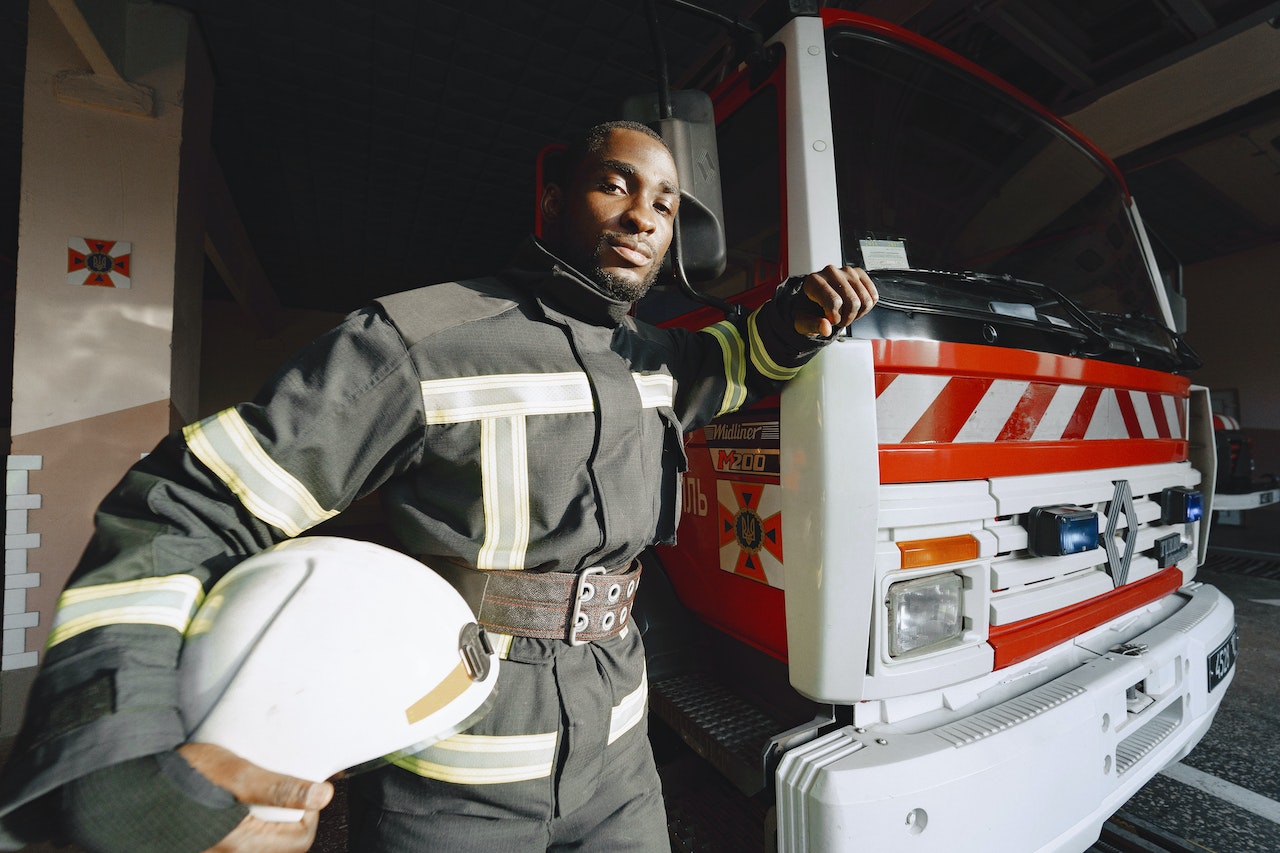 person standing in front of emergency vehicle 