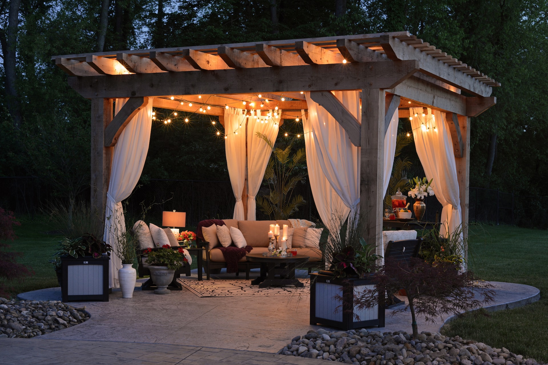 a nice outdoor sitting area lit up with lights