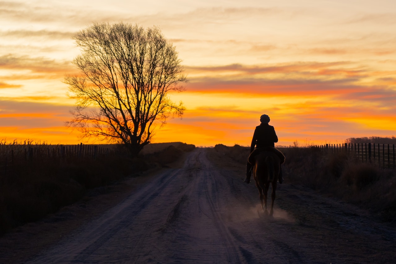 riding a horse during sundown
