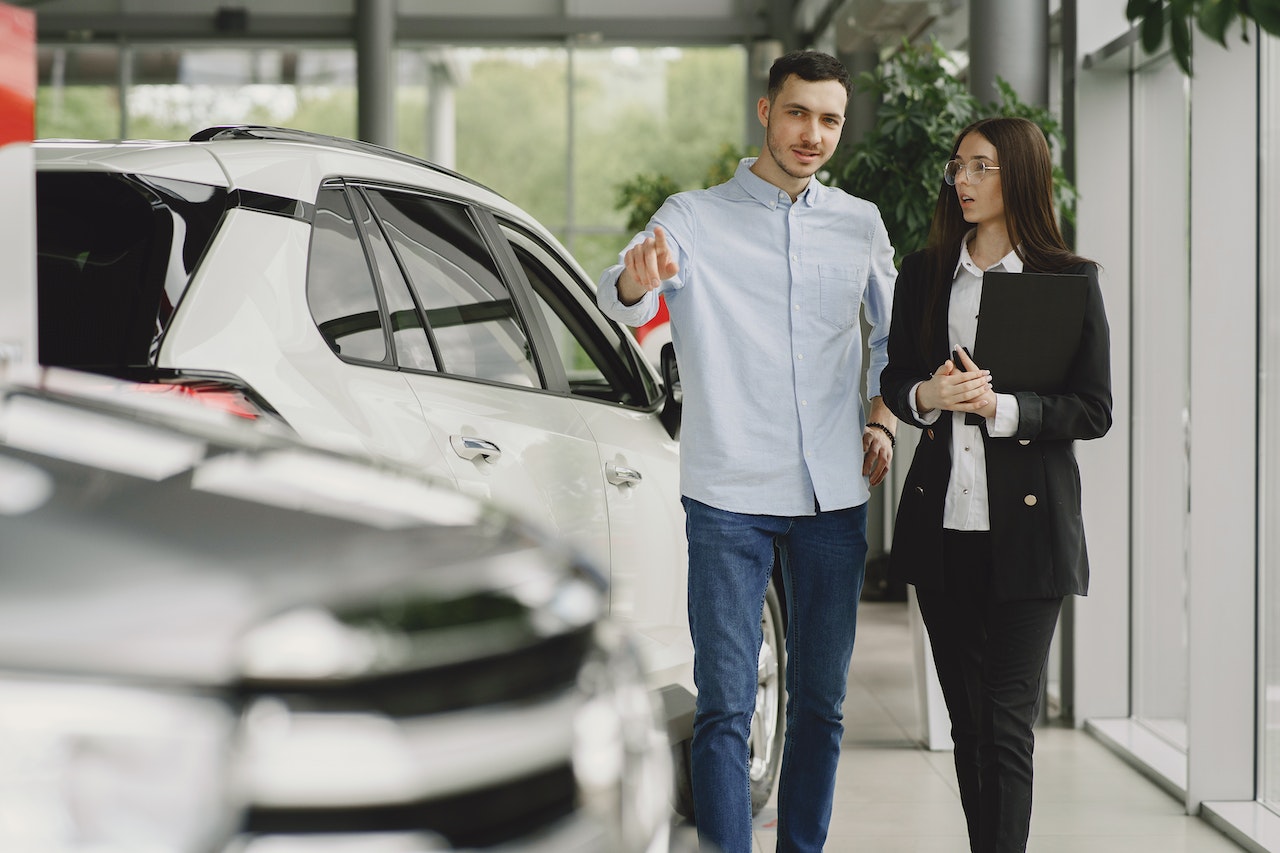 checking out cars to buy at a dealership