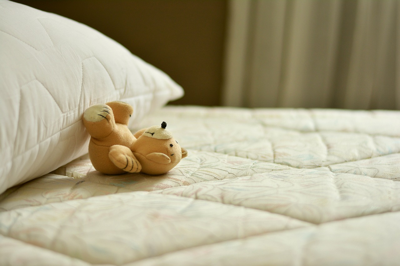 teddy bear on a mattress 