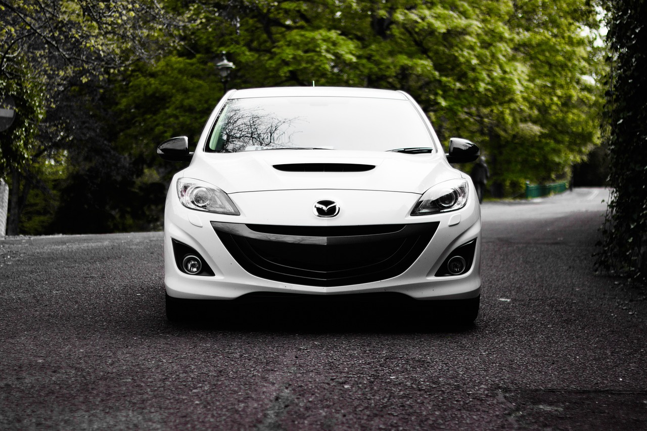 front view of a white mazda car