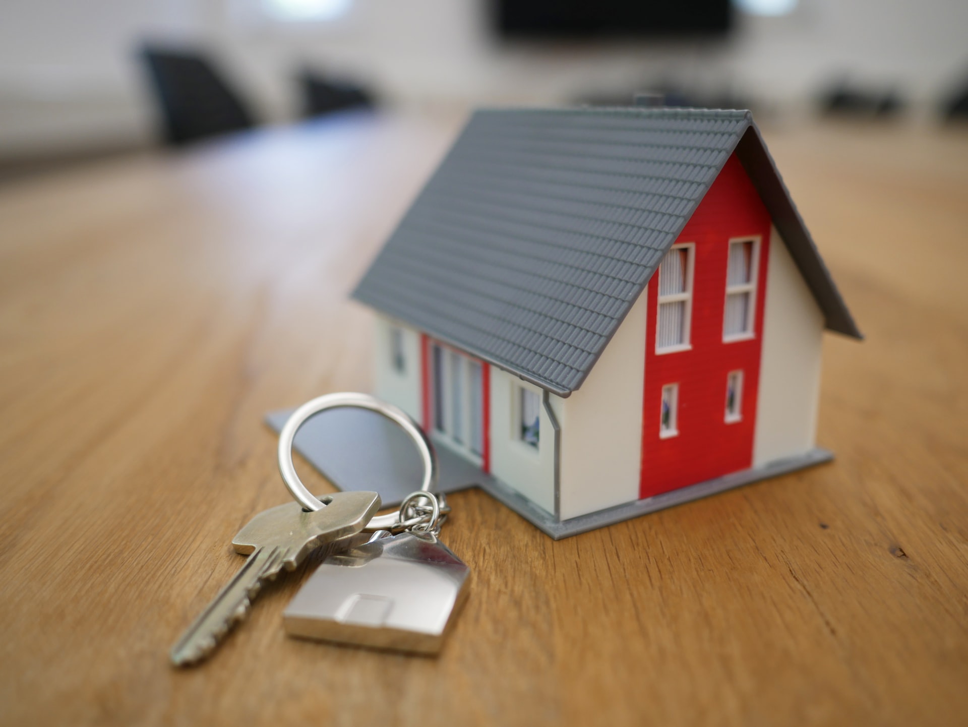 model house with keys beside it