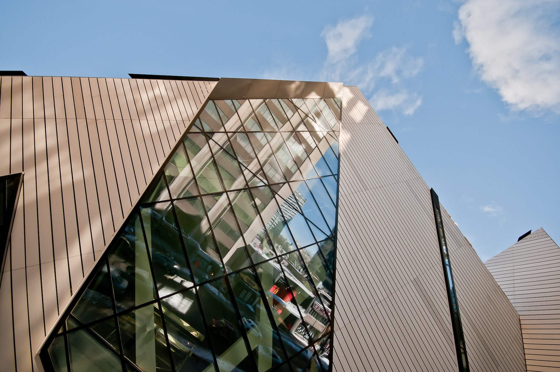 a long window surrounded by metalwork on a building