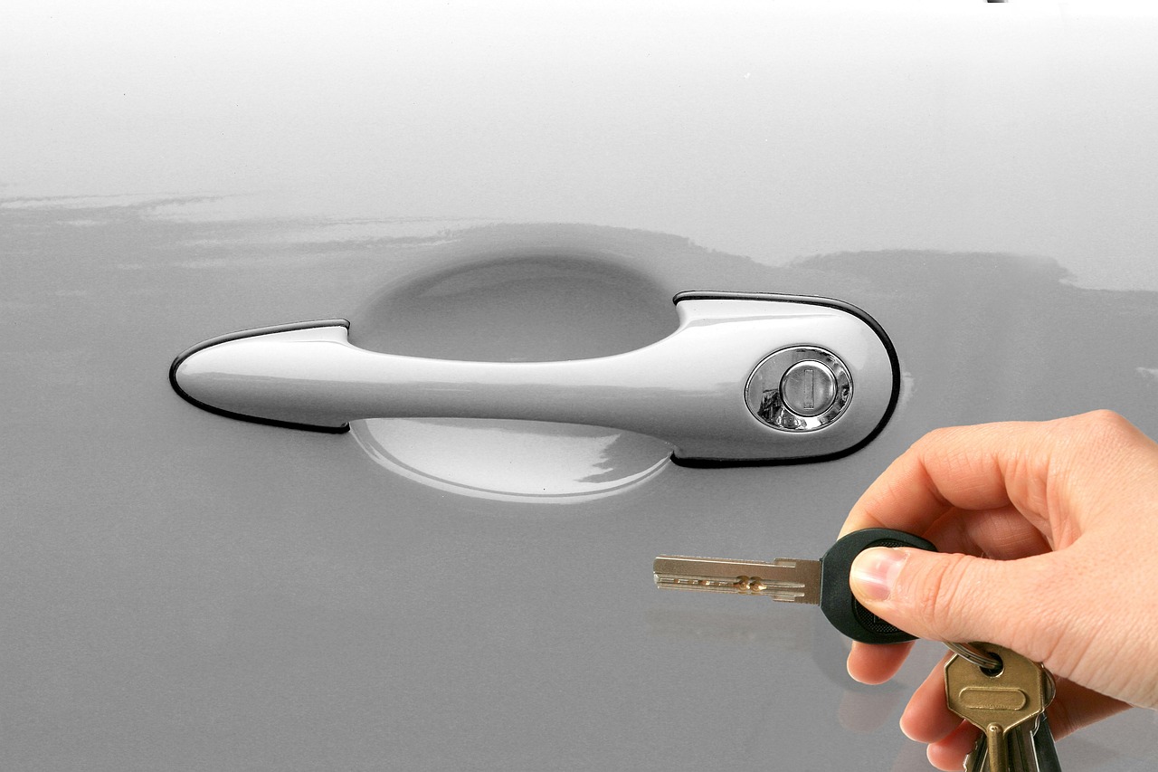 opening a locked car door with a key