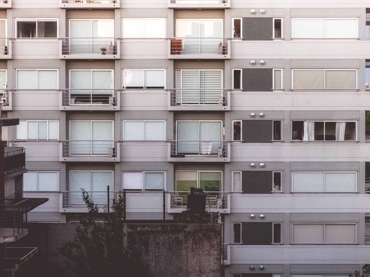 white and beige condo buildings