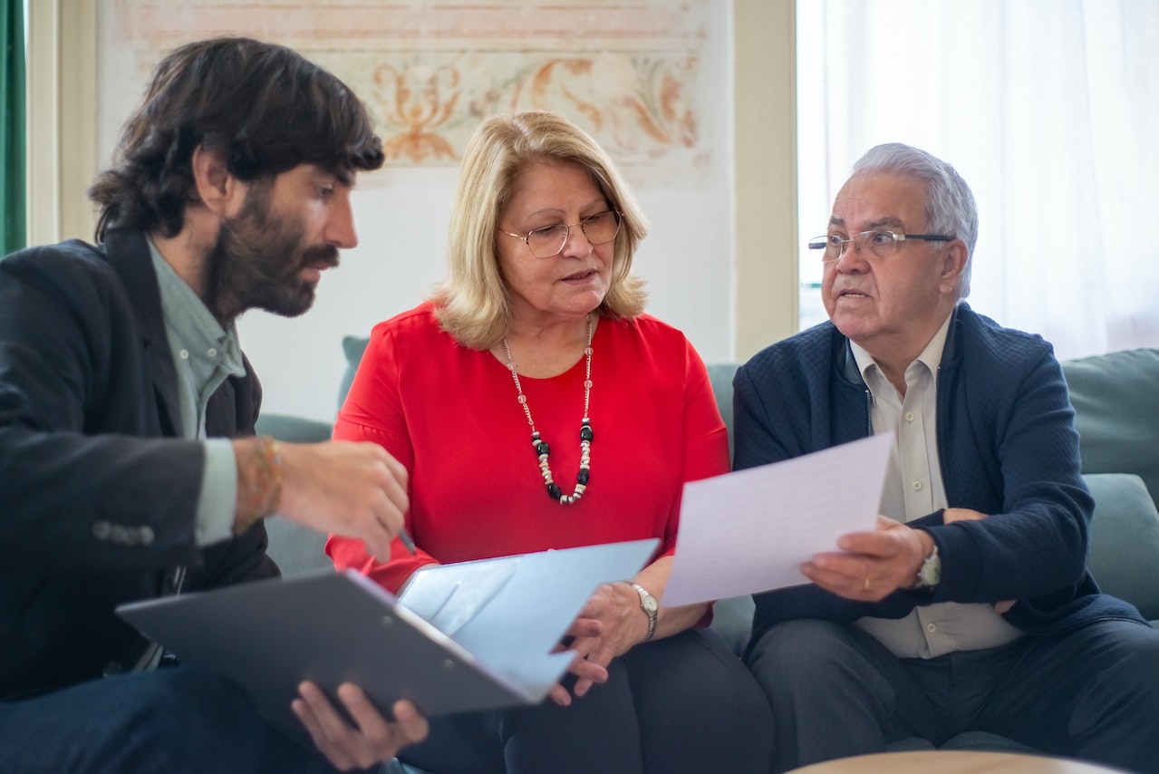 people going over an agreement with an adjuster