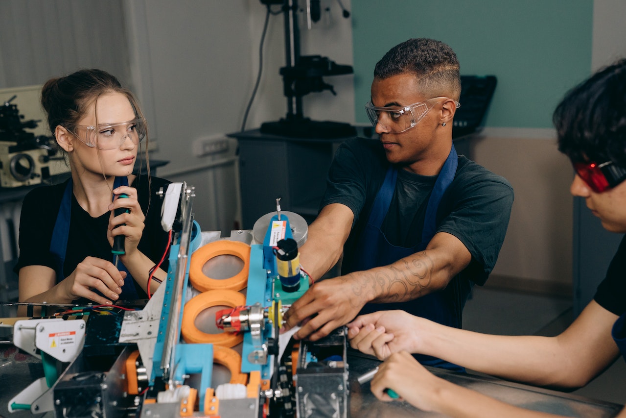 team putting together a product on a line