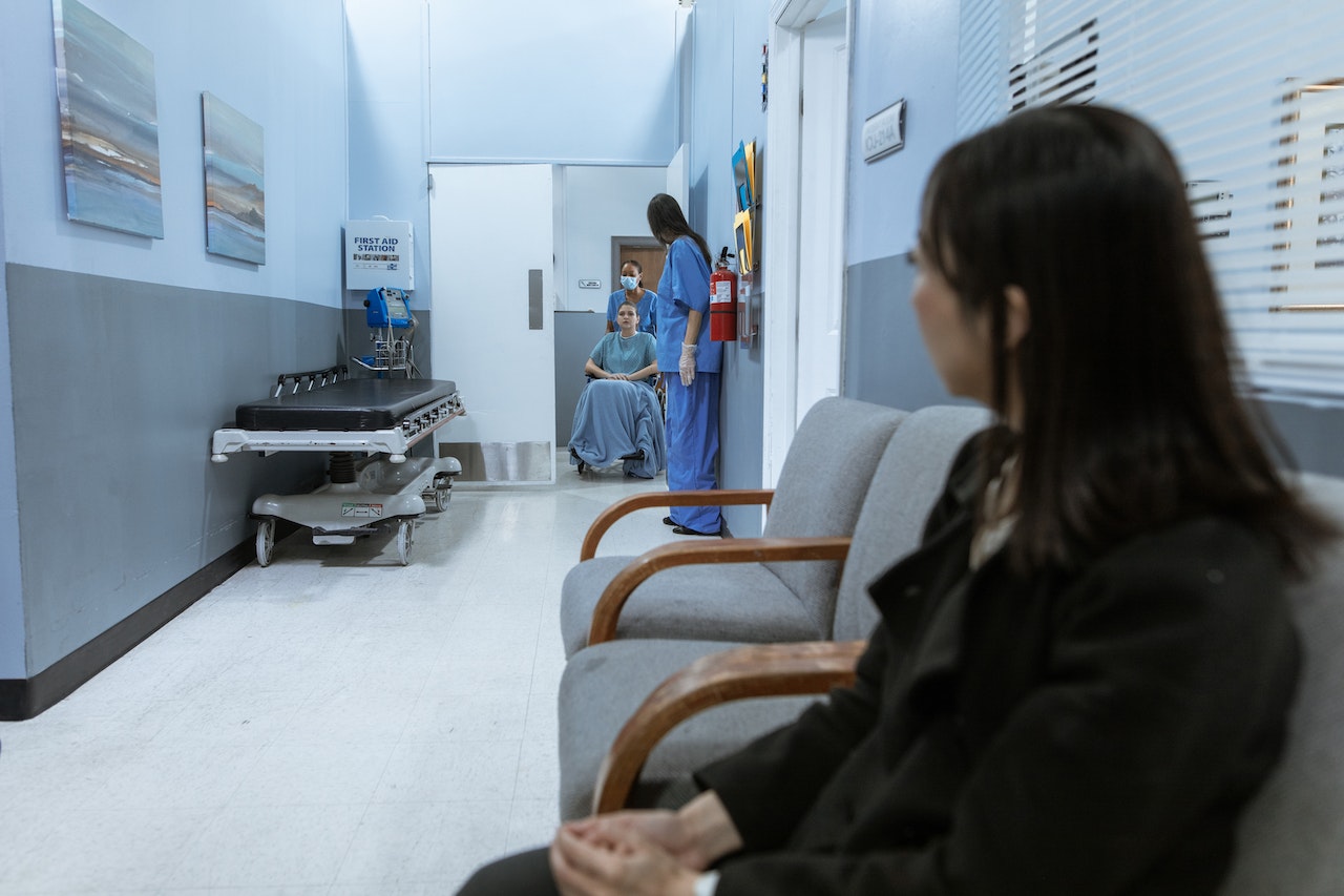 people sitting in a waiting room at a doctor office