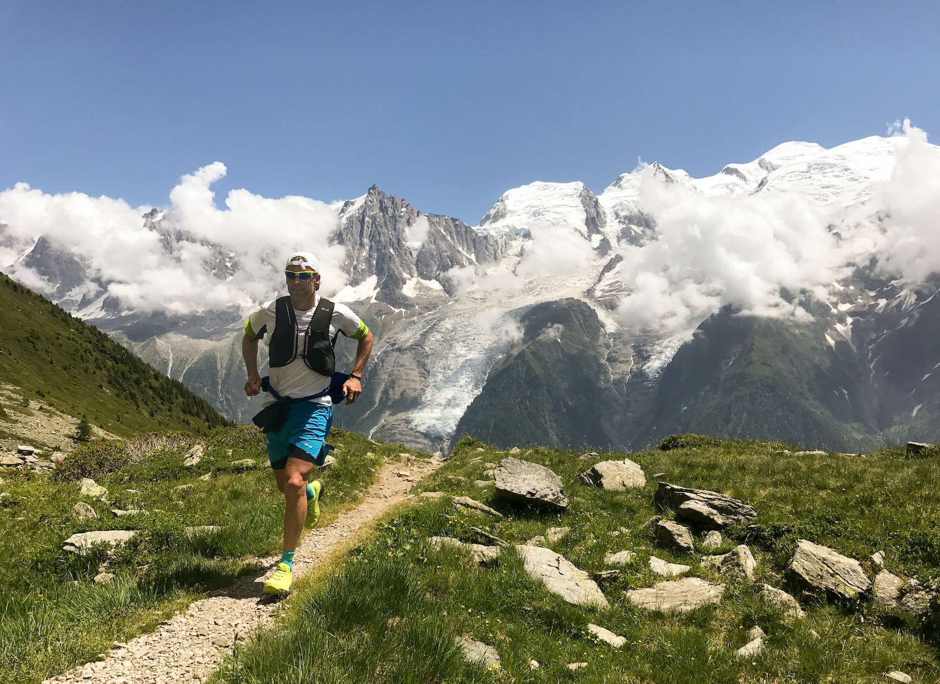 person running along a path with a bag