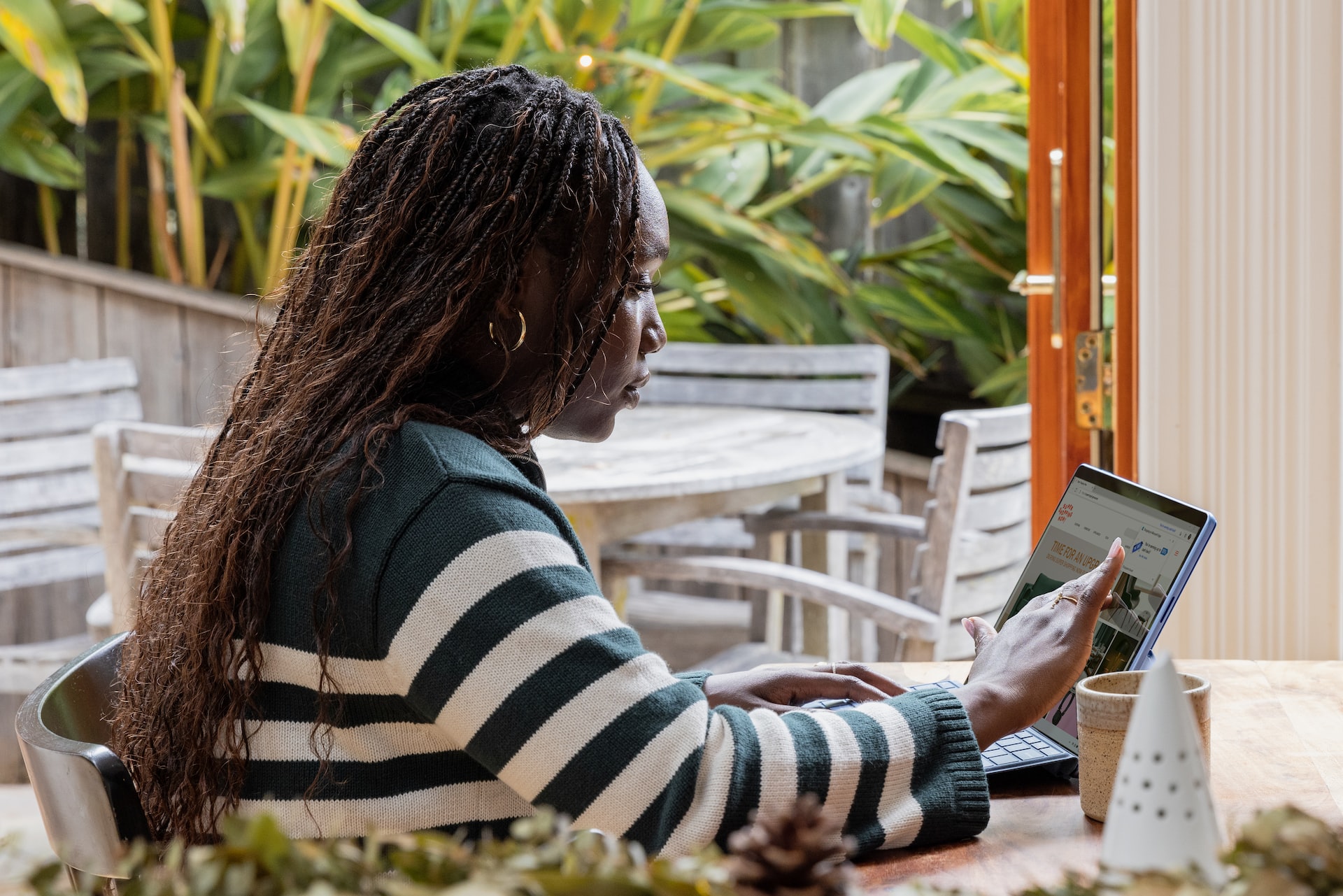 person checking website while outside on a patio