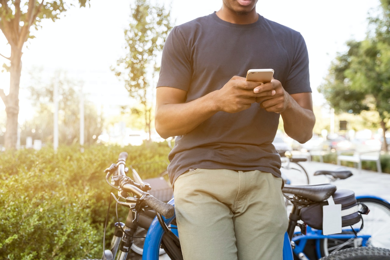 person outside using an app on their cell phone