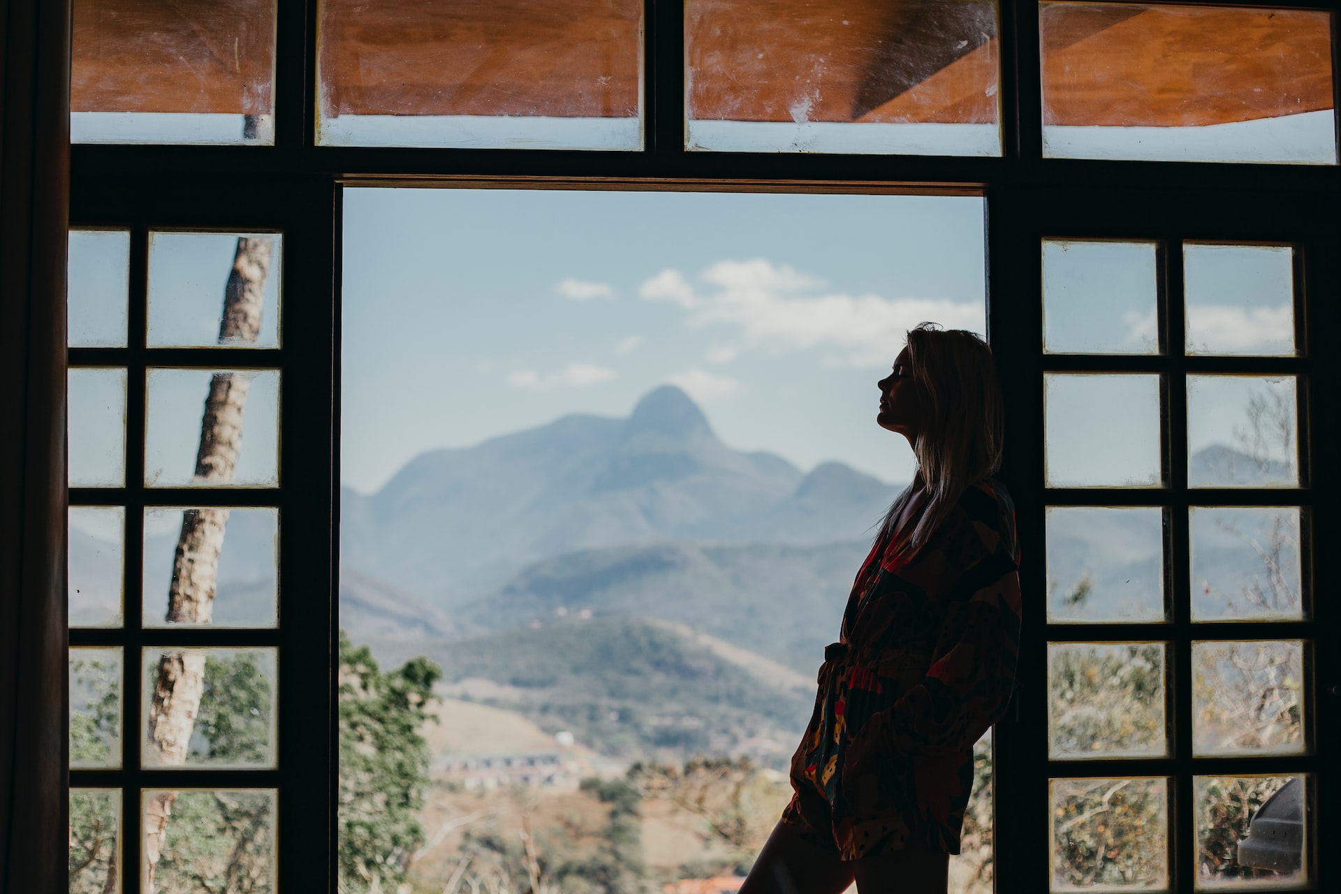 standing near a door with a background of a desert