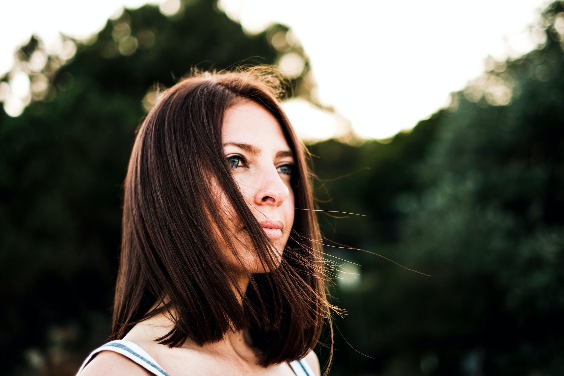 person standing outside near some trees