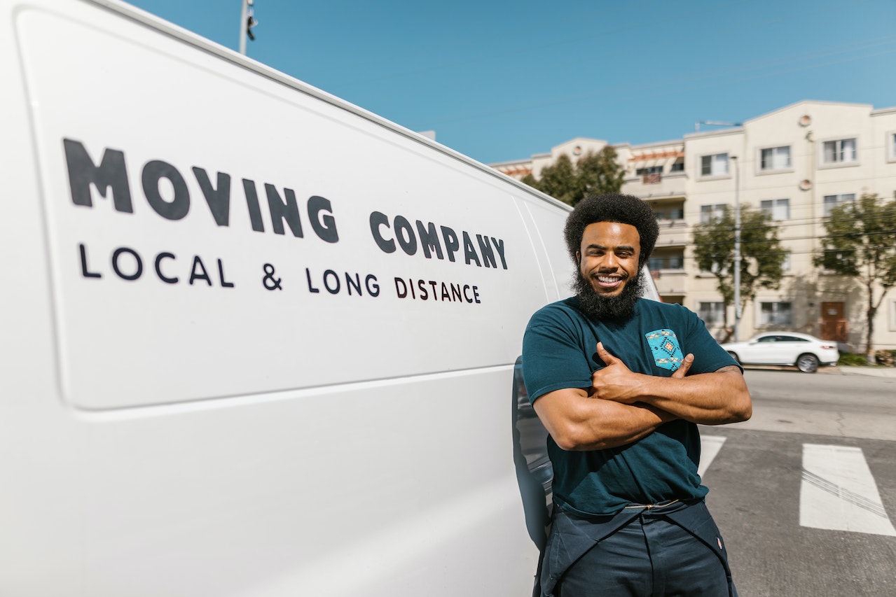 a moving guy looking happy to help