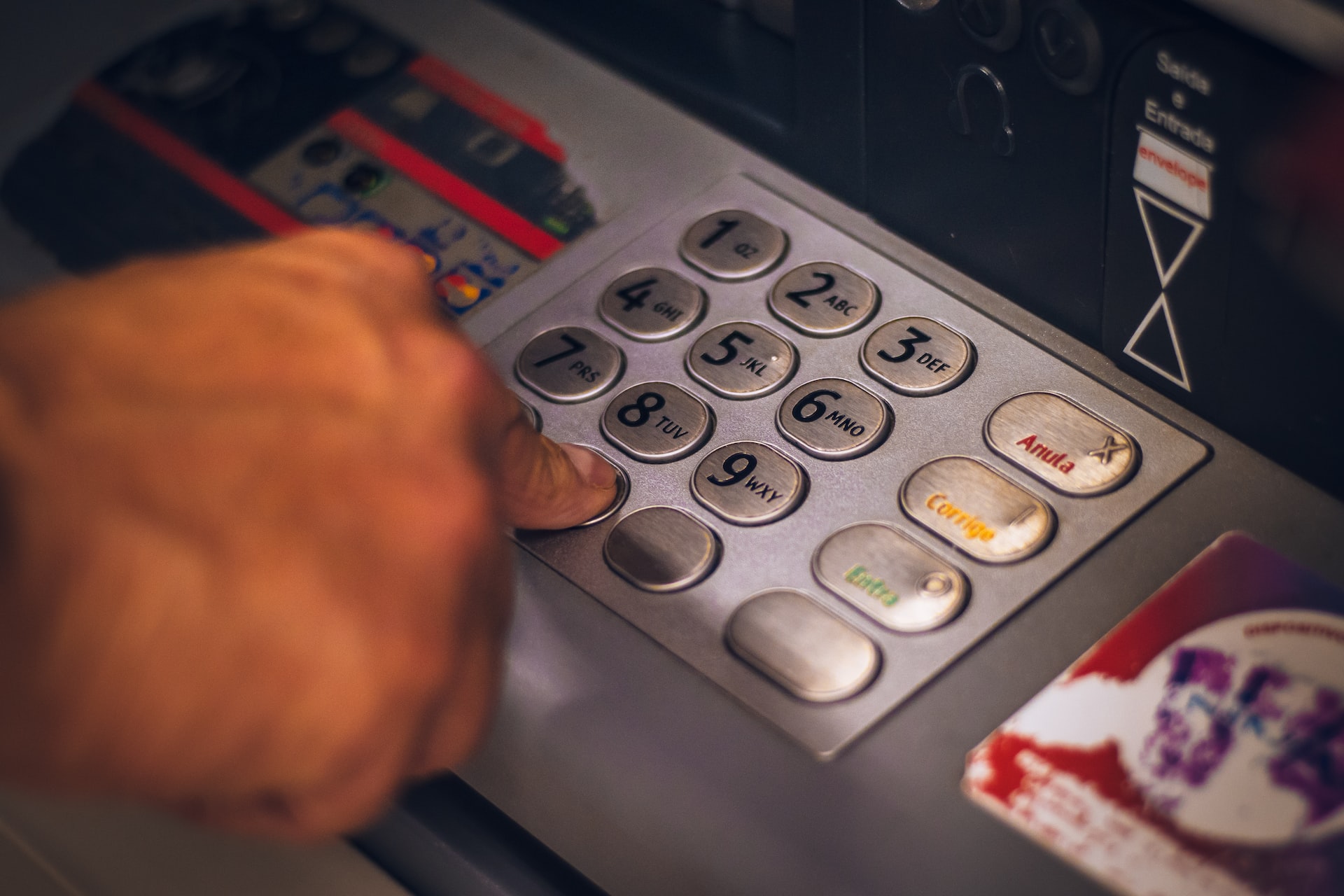 pressing numbers on a banking machine
