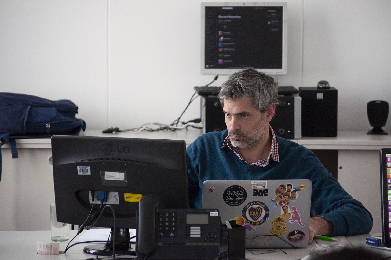 project manager looking at a computer