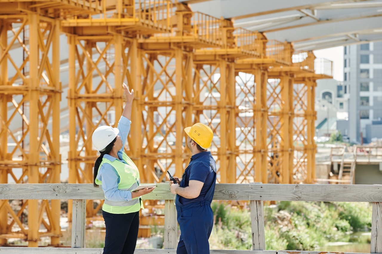 two people in protective gear on a construction jobsite