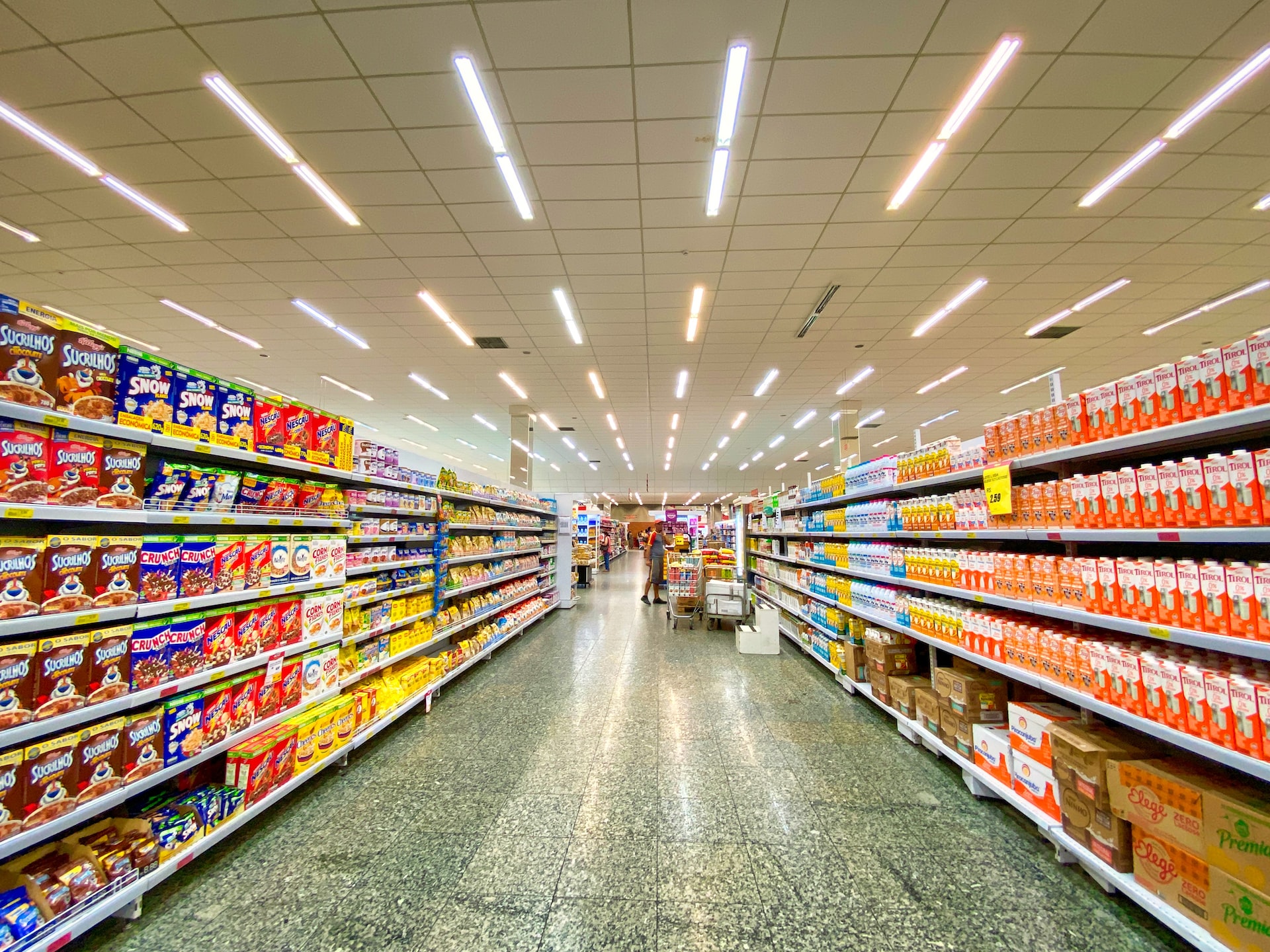 a row of food on shelves in a grocery store