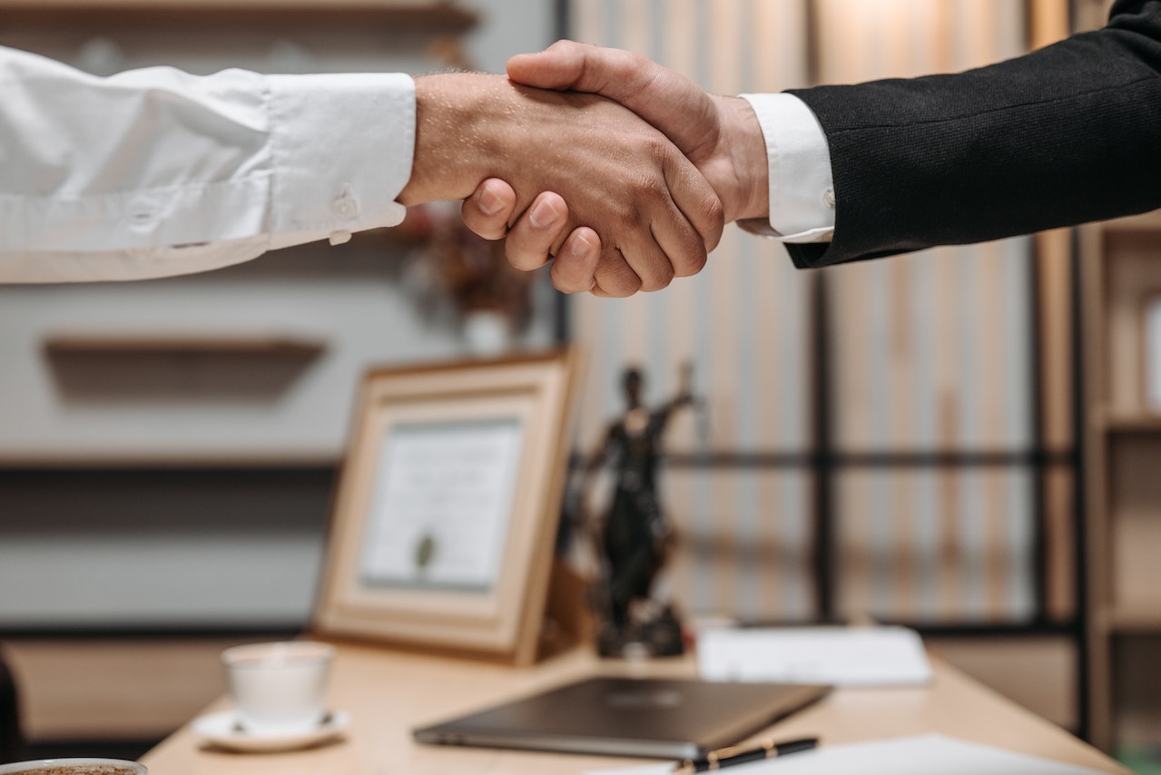 shaking hands in a lawyers office