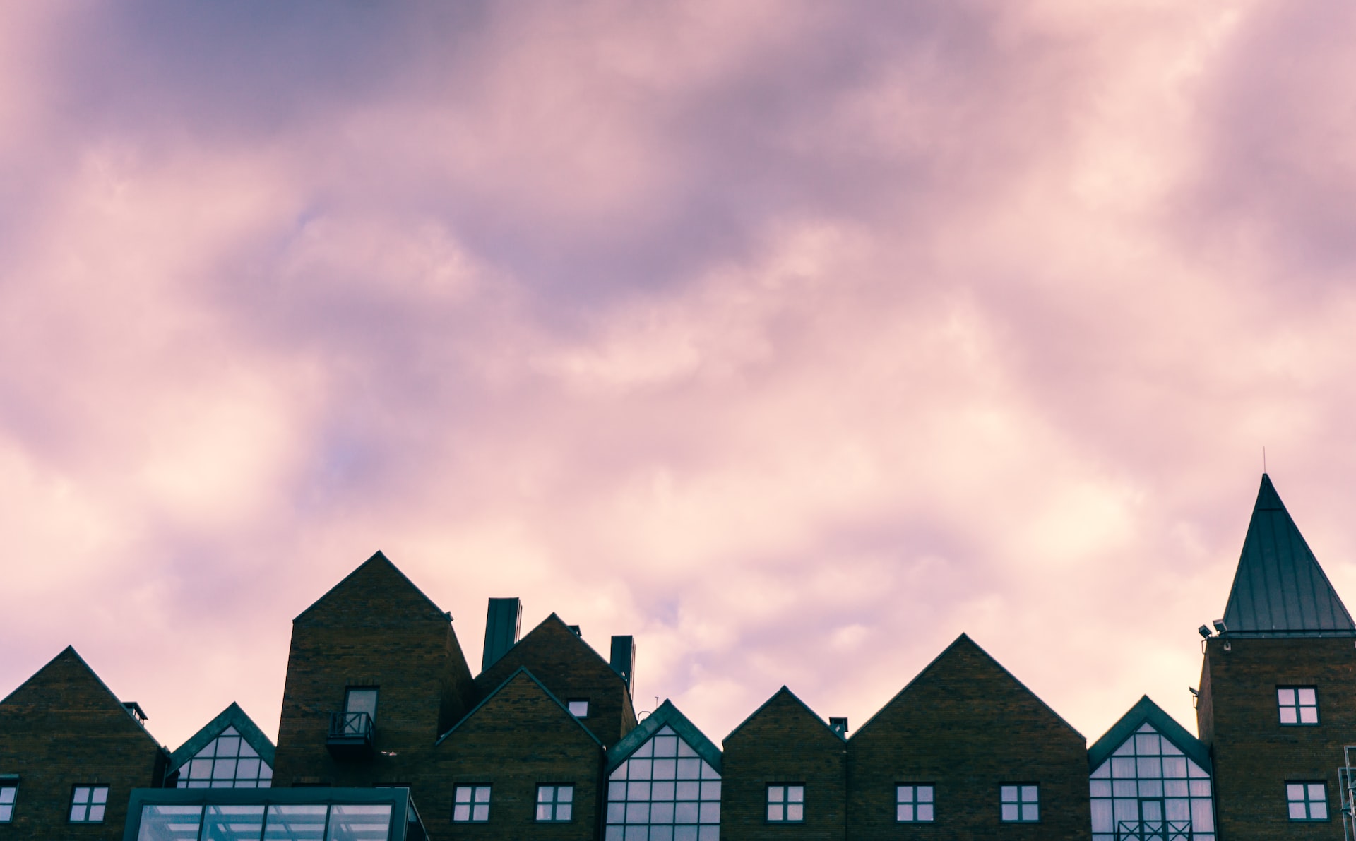 sun going down over a block of houses