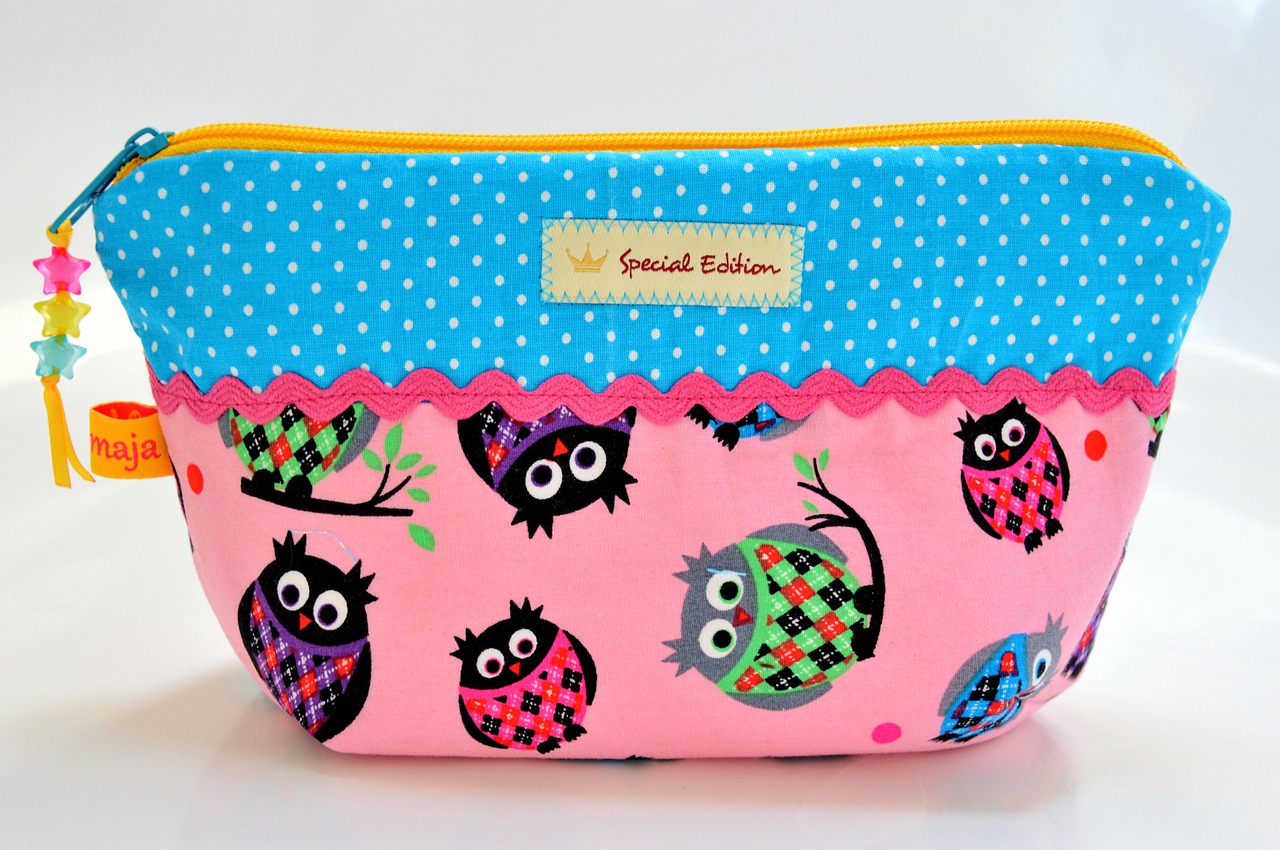 a small makeup bag with a kids print on it