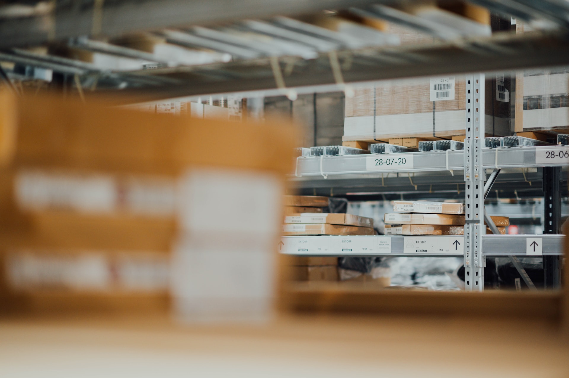 zoomed in picture of boxes on warehouse shelving