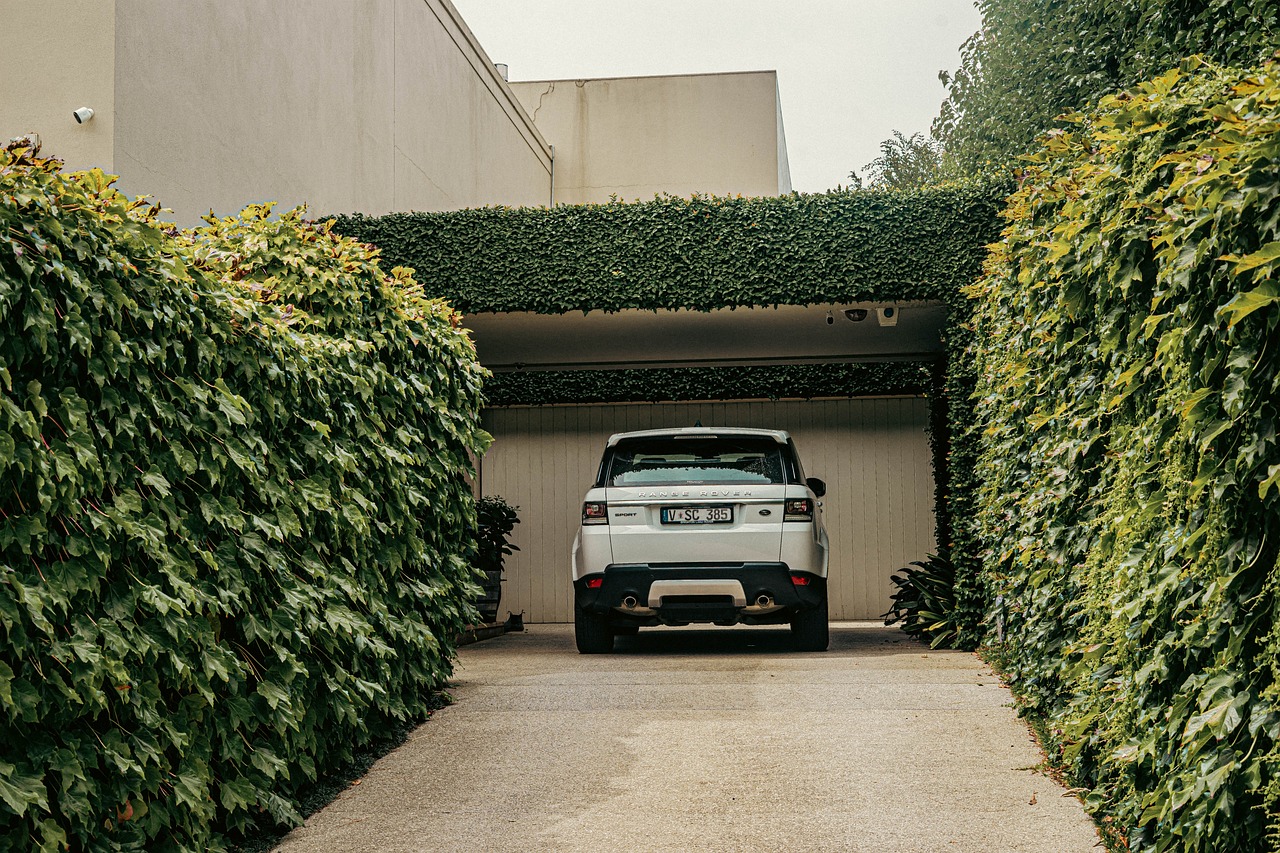 luxury suv parked in a car port