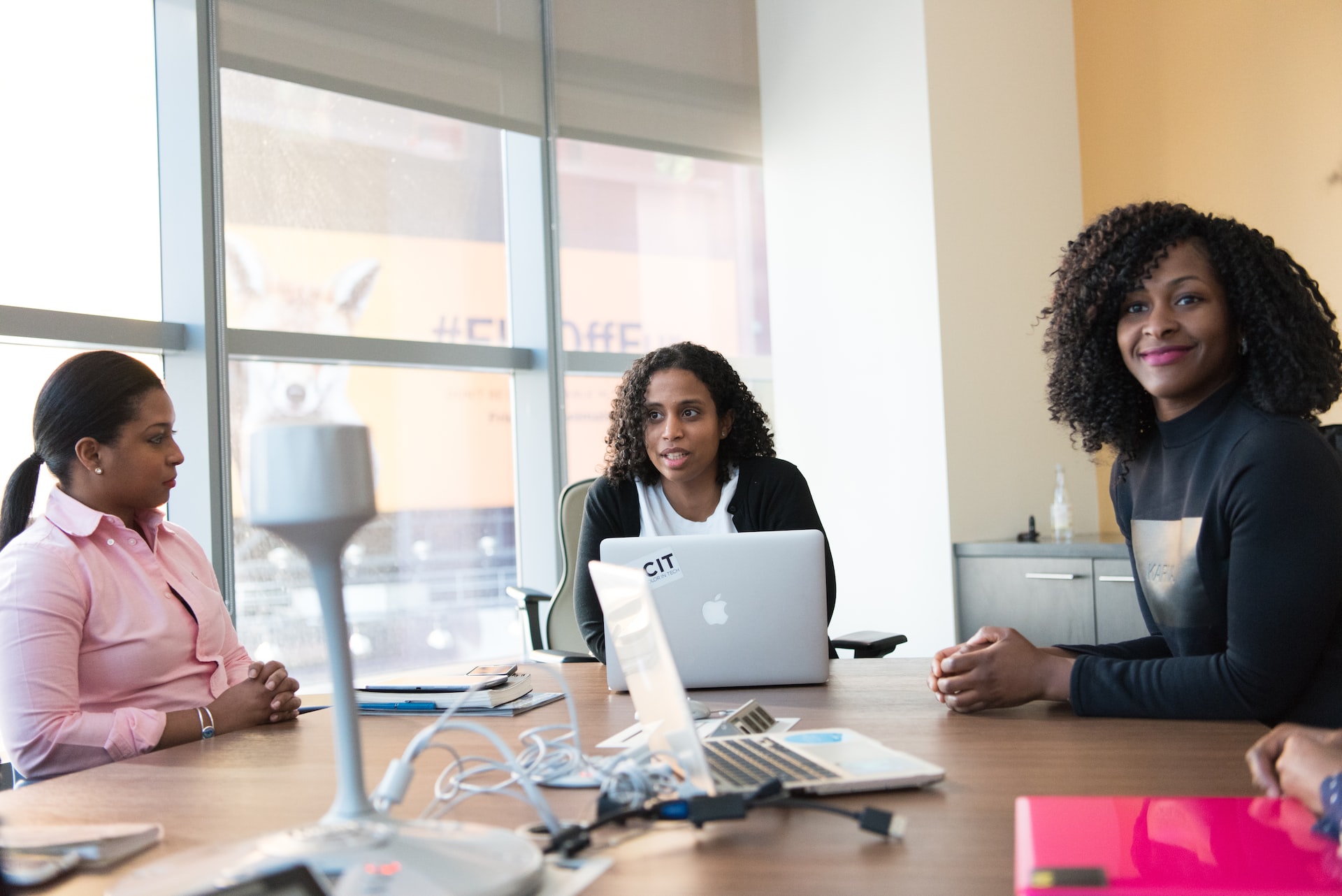 team members at a table getting ready for a video conference 