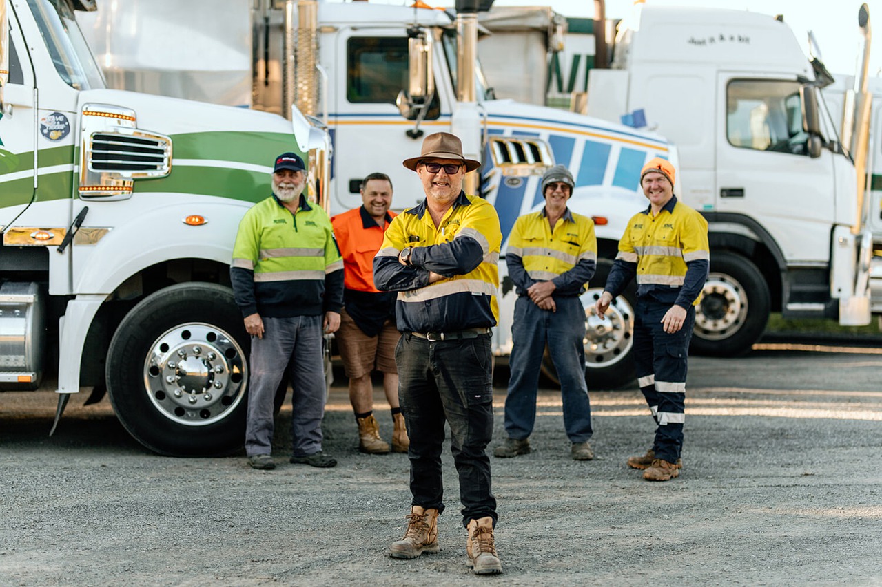 truck drivers in front of semis