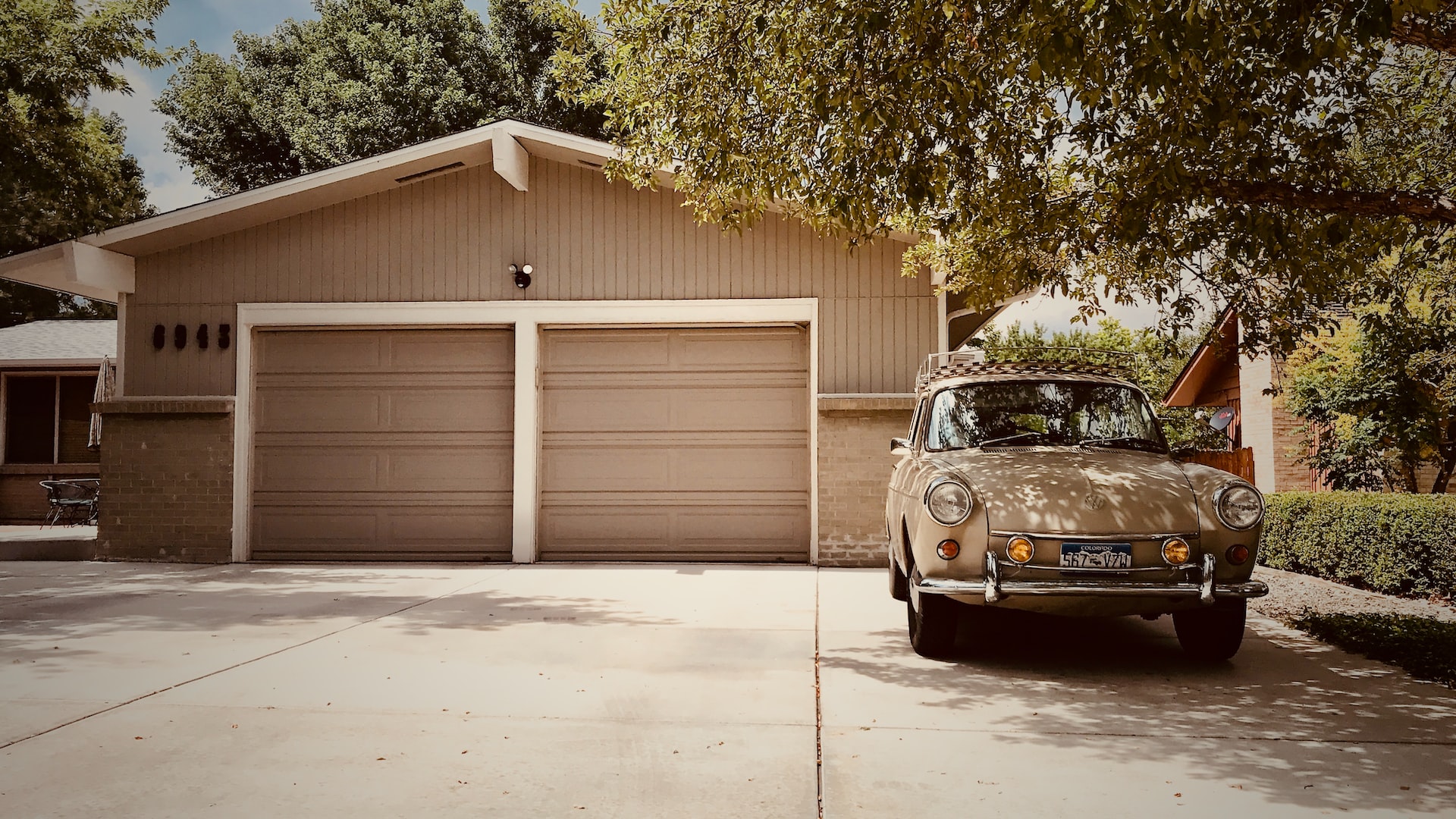 a nice brown double garage with two closed doors