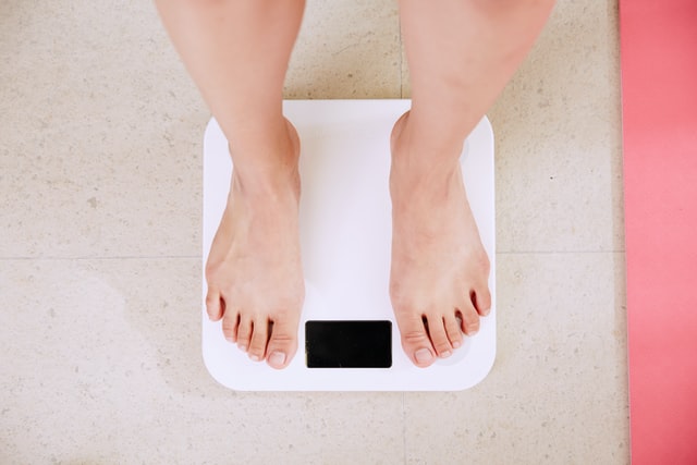 top view of feet on a digital scale