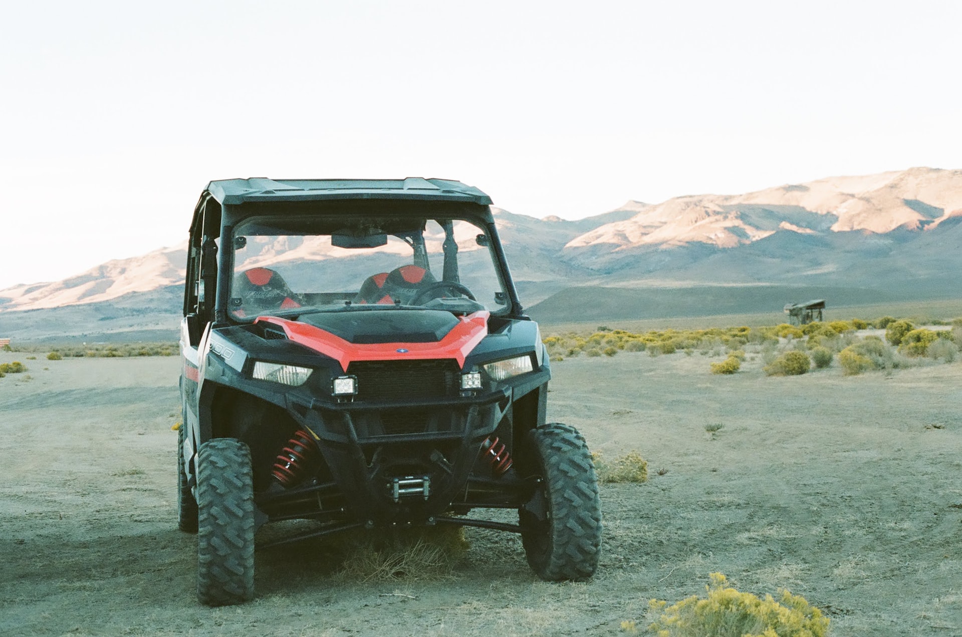 black and red UTV parked outside