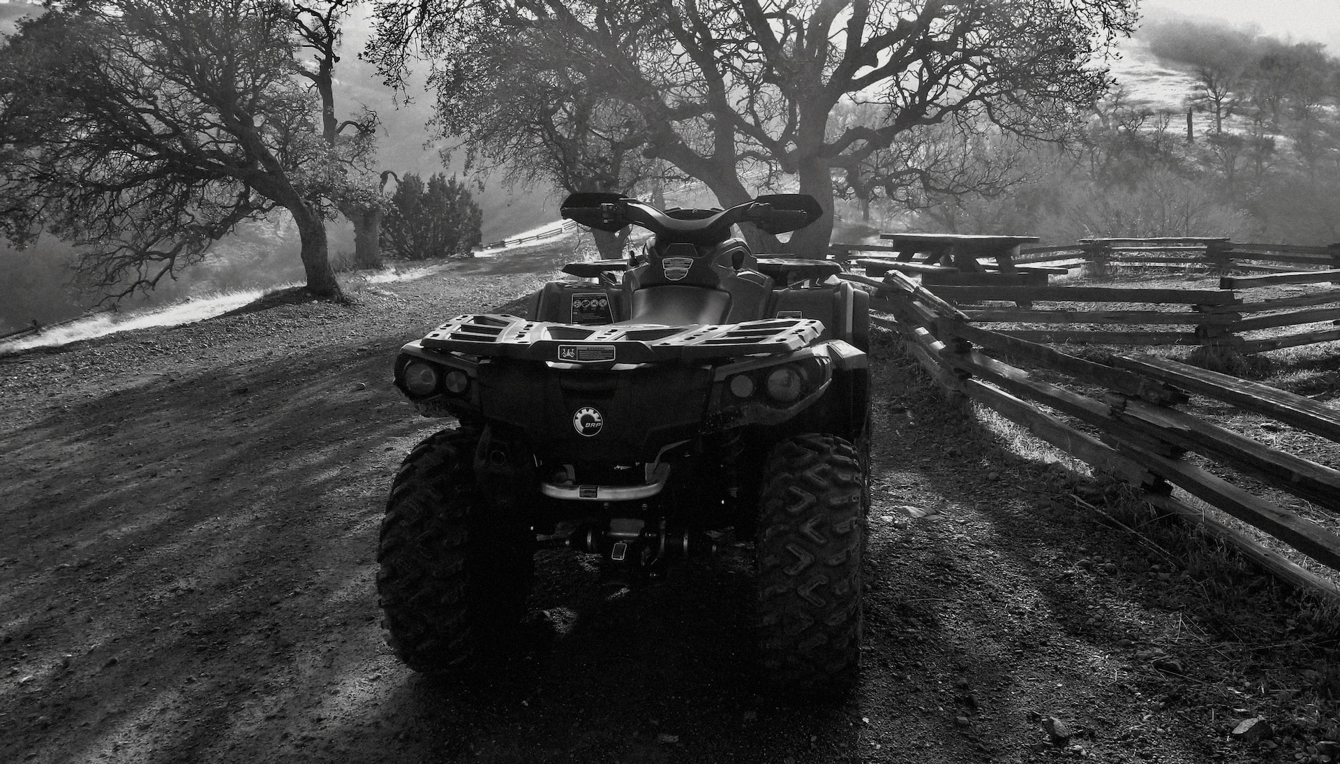 black and white picture of utv parked outside