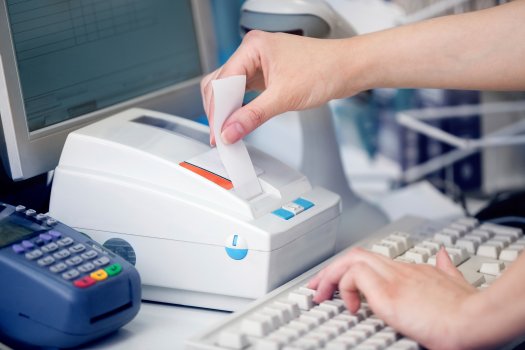 woman extracting receipt, pos, flagship