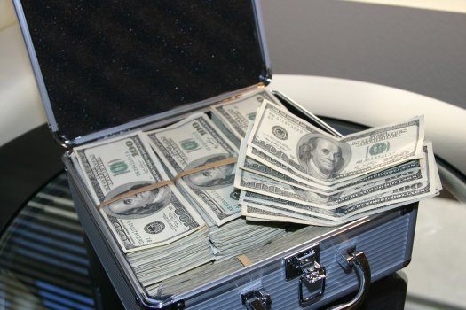 suitcase full of dollar bills, payday loans, money today